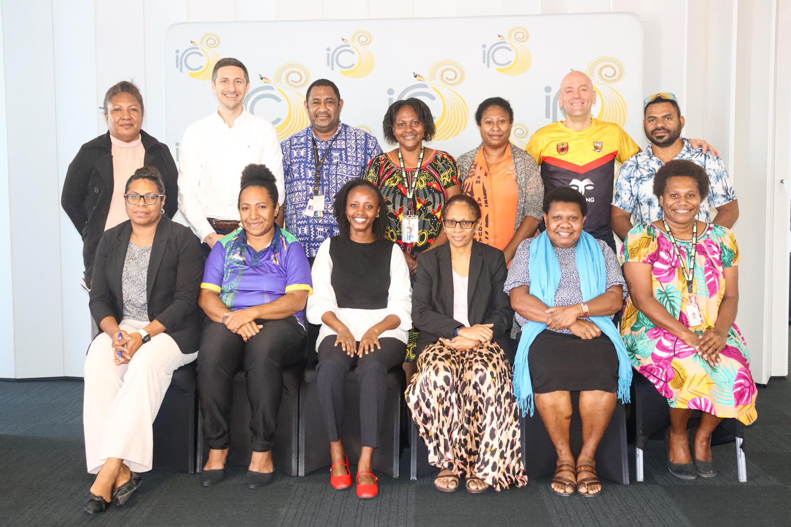 Photo of OECD and IGF staff sitting alongside officials from Papua New Guinea in Port Moresby
