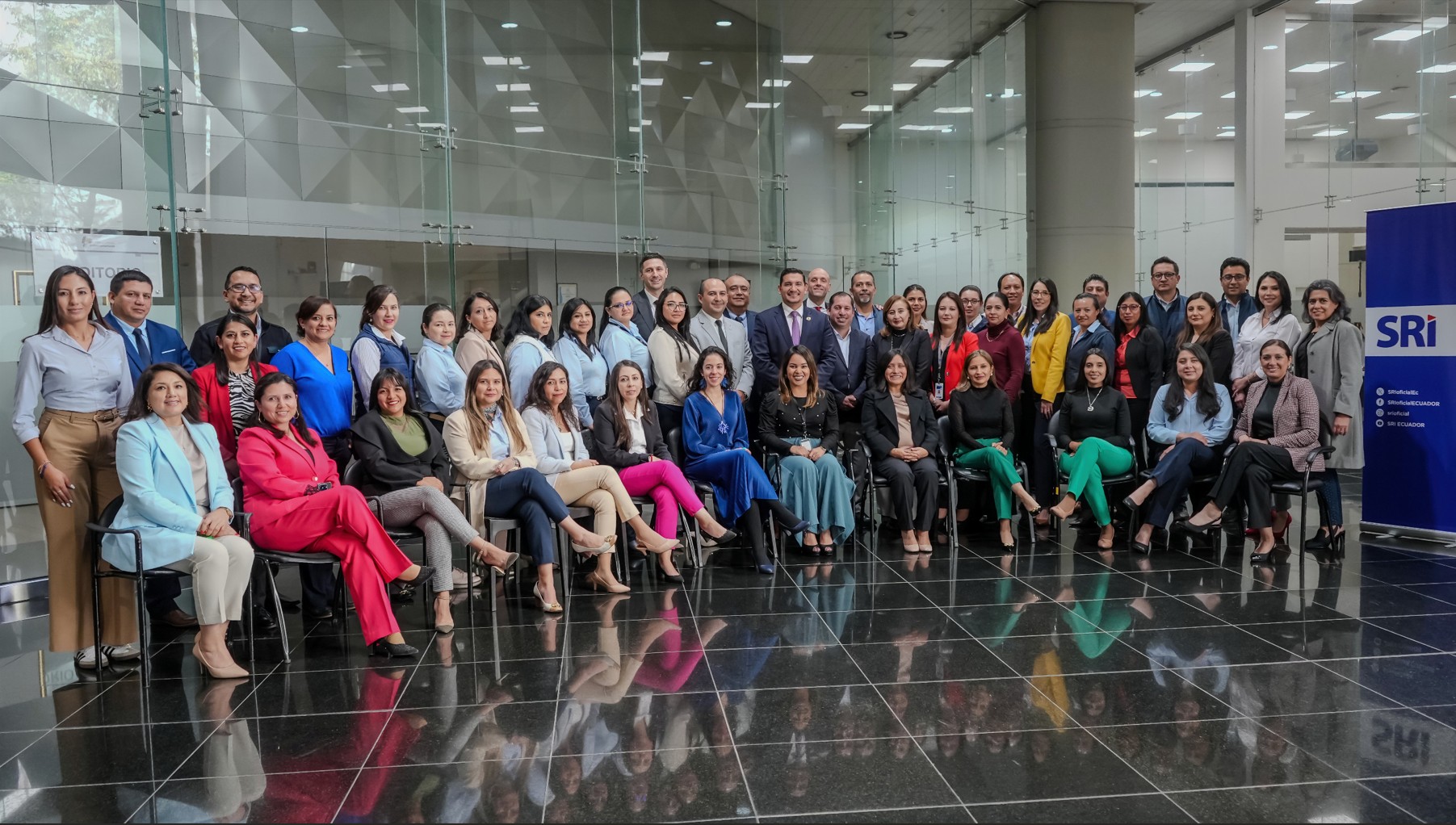 Group photo of approximately 40 people sitting and standing.