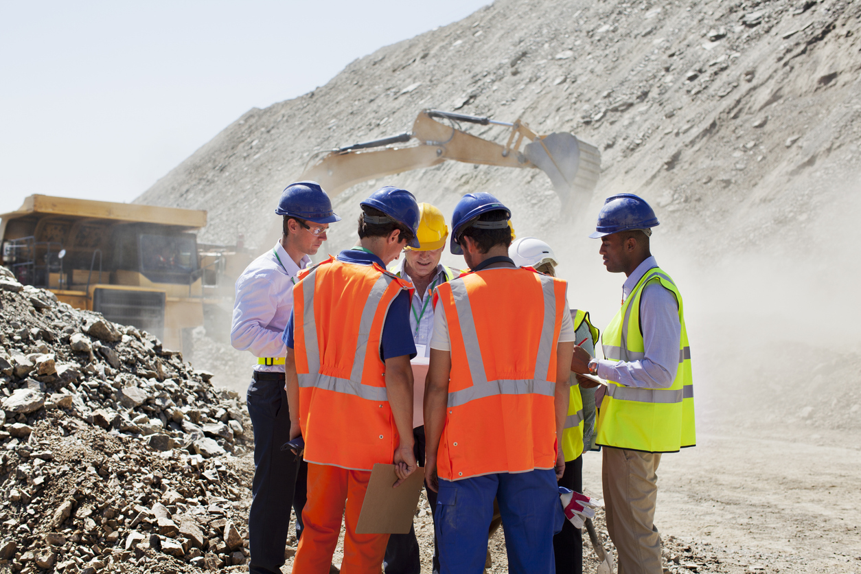 Workers talking in quarry